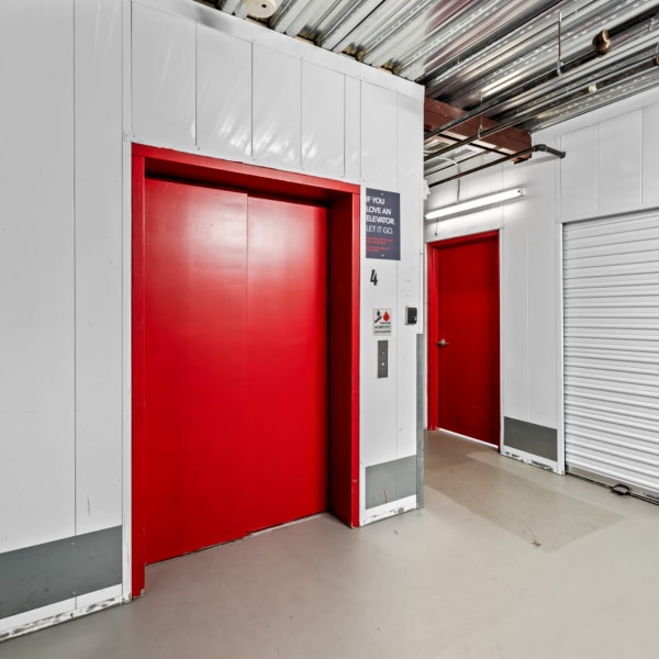 Outdoor storage units with beige doors at StorQuest Self Storage in Richmond, California