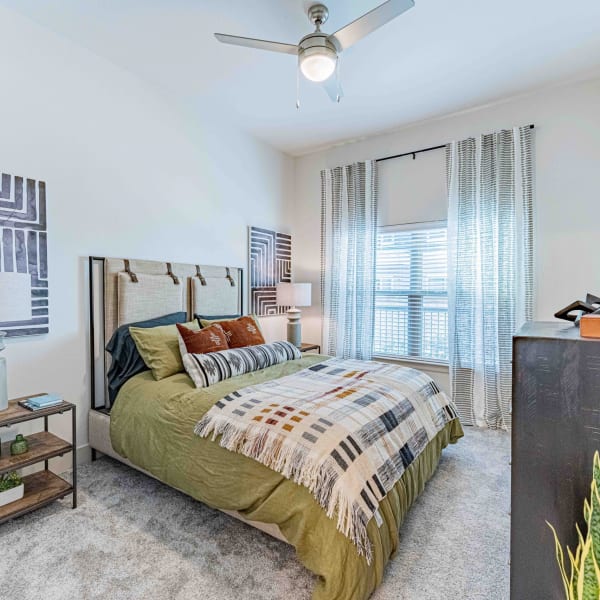 Modern bedroom with natural lighting at The Everett at Ally Village in Midland, Texas