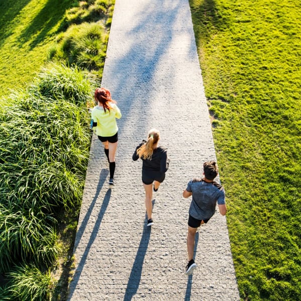 Residents running outside the beautifully landscaped grounds at Magnolia Chase, Virginia Beach, Virginia