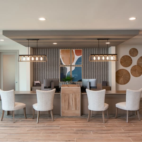 Community office with trendy lighting and upholstered seating at Bellrock Memorial in Houston, Texas