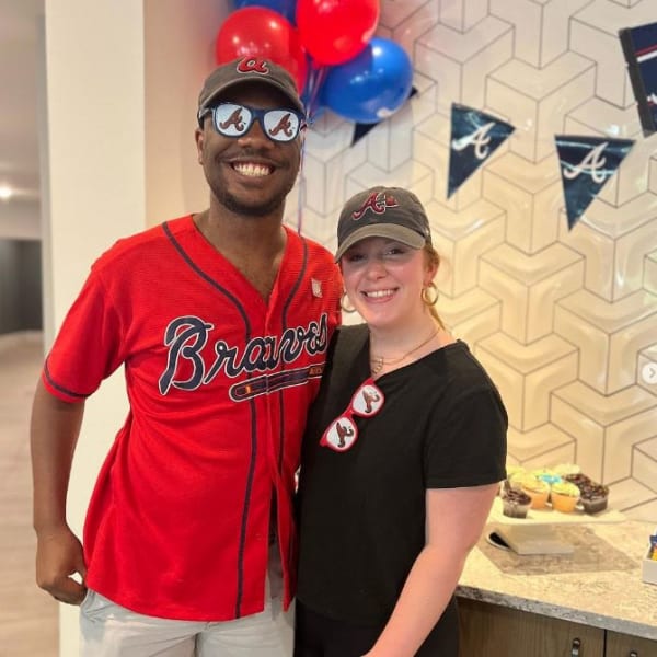 Couple wearing baseball attire at Revel Ballpark in Smyrna