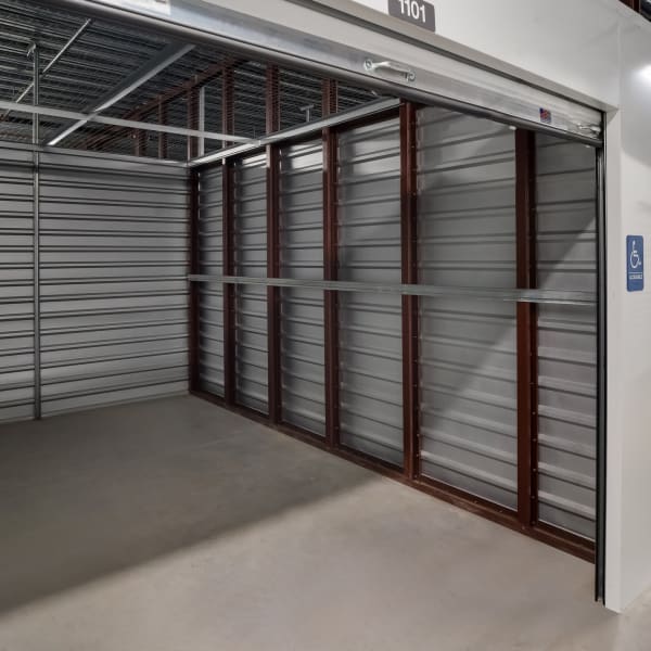 Inside a large, accessible storage unit at StorQuest Self Storage in Tarpon Springs, Florida