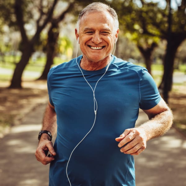 Elderly man exercising in park near Valley Oaks in Hurst, Texas