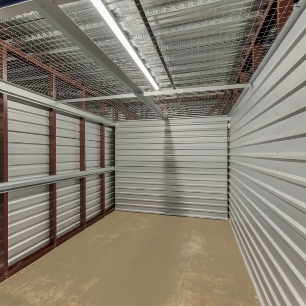 Inside a large climate-controlled storage unit at StorQuest Self Storage in Deer Park, New York