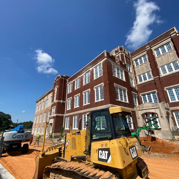 A bulldozer in front of a newly constructed community served by Intervest Corporation in Madison, Mississippi