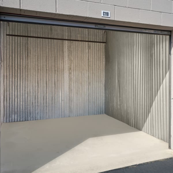 An open outdoor storage unit at StorQuest Express Self Service Storage in Sacramento, California