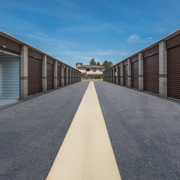 Outdoor storage units with wide driveways at StorQuest Self Storage in Aurora, Colorado