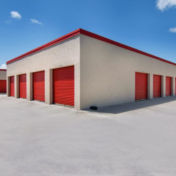 Outdoor storage units with bright doors at StorQuest Self Storage in Port St Lucie, Florida