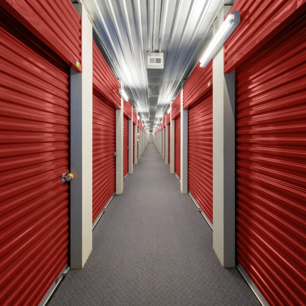 Red doors on indoor units at StorQuest Economy Self Storage in Houston, Texas