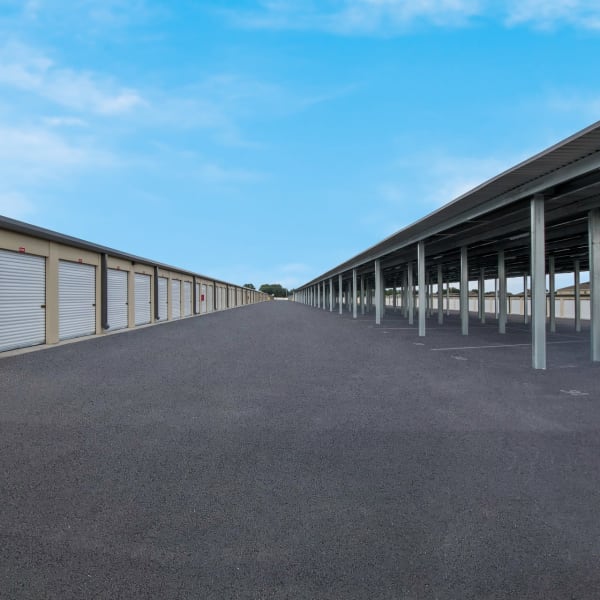 Outdoor units and covered vehicle storage at StorQuest Self Storage in Auburndale, Florida