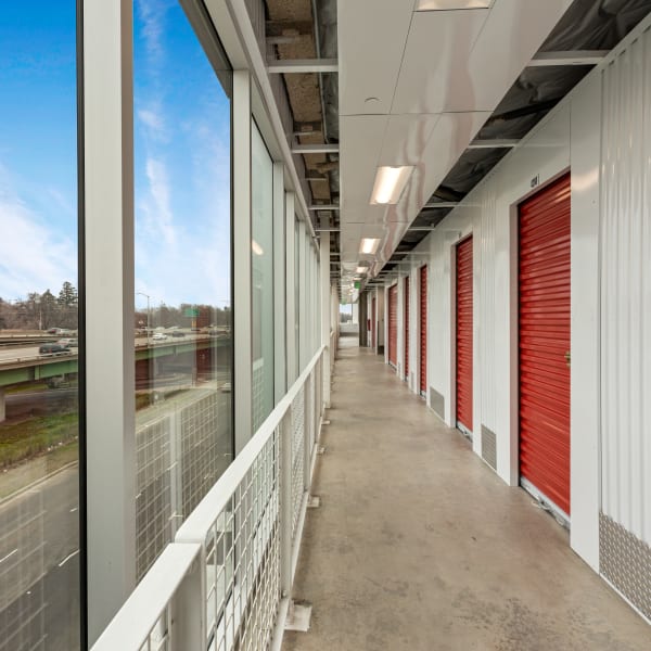 Indoor storage units with bright doors at StorQuest Self Storage in Miami, Florida