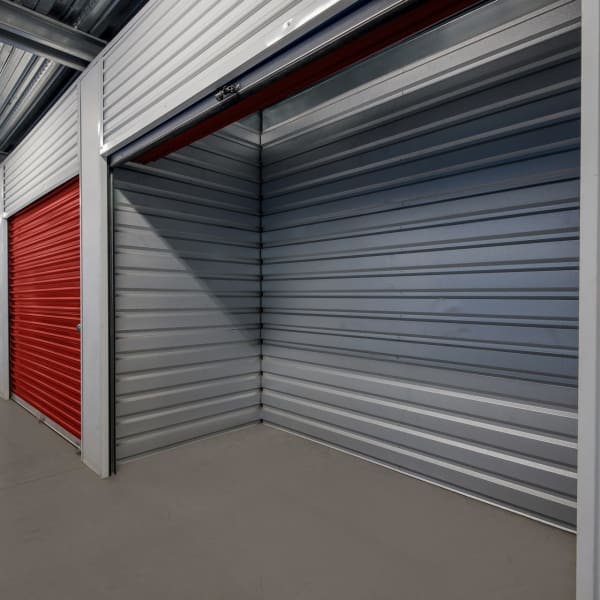 Open indoor units with red doors at StorQuest Self Storage in Carson, California