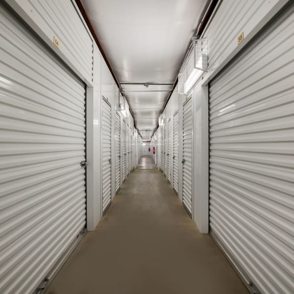 Indoor storage units with white doors at StorQuest Self Storage in Manitou Springs, Colorado