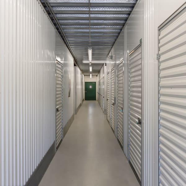 White doors on indoor climate-controlled units at StorQuest Self Storage in Aurora, Colorado