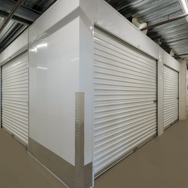 Indoor storage units with white doors at StorQuest Self Storage in Thousand Oaks, California