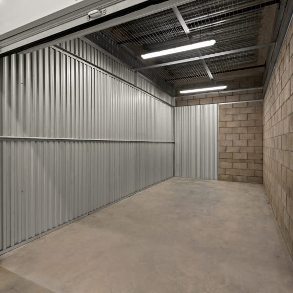 Inside a large indoor storage unit at StorQuest Self Storage in Ventura, California