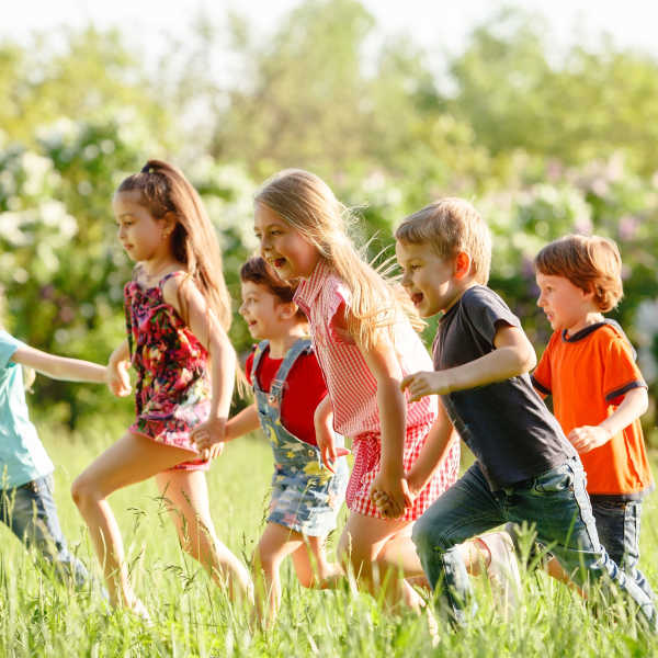 Kids running in a field near 207 East in Edgewood, Washington