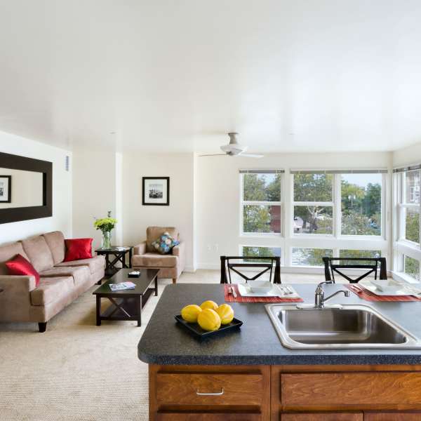 Living room and pass-through to the kitchen of a model apartment at Metro Green Apartments in Stamford, Connecticut