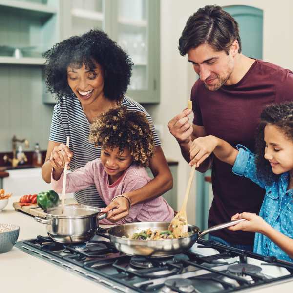 Family cooking dinner at Mayfair Reserve in Wauwatosa, WI