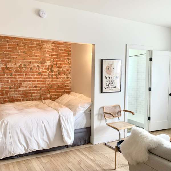 Cozy bedroom at Detroit Living in Detroit, Michigan
