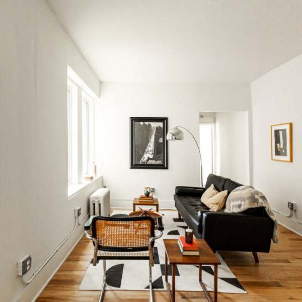 Spacious living room with couch at Detroit Living in Detroit, Michigan