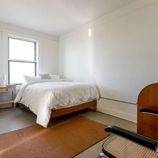 Bedroom with with window at Detroit Living in Detroit, Michigan