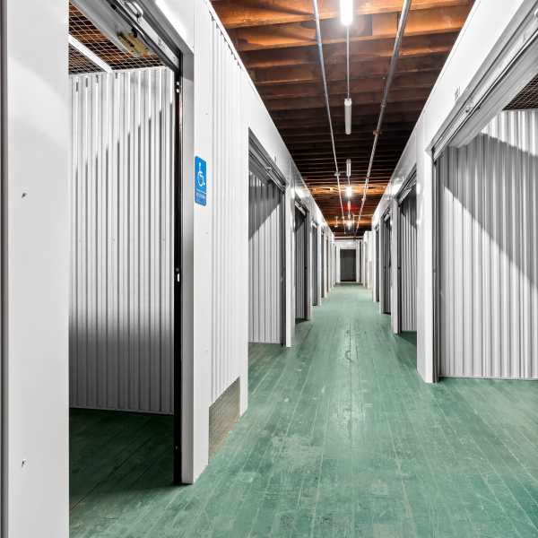Indoor storage units with bright doors at StorQuest Self Storage in Stockton, California