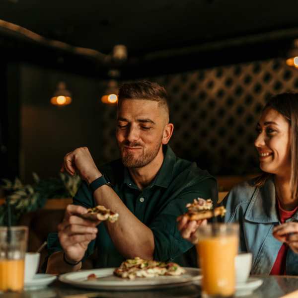 Happy couple eating near Detroit Living in Detroit, Michigan