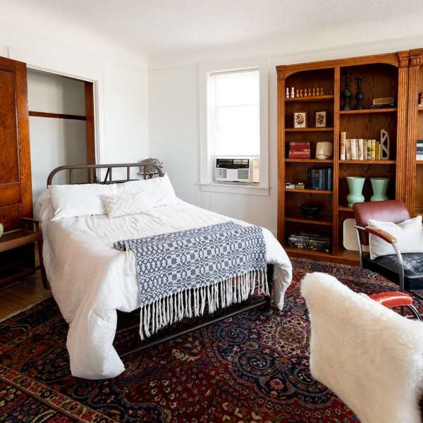 Bookshelf in bedroom at Detroit Living in Detroit, Michigan