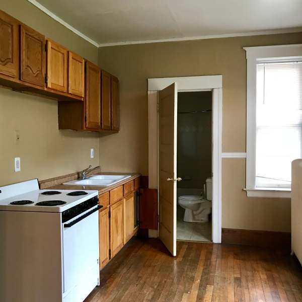 Kitchen with oven at Detroit Living in Detroit, Michigan