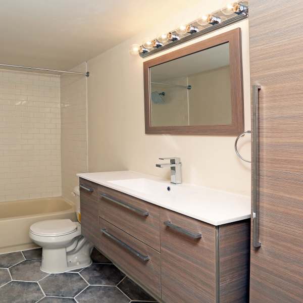 Bathroom with big mirror at Detroit Living in Detroit, Michigan