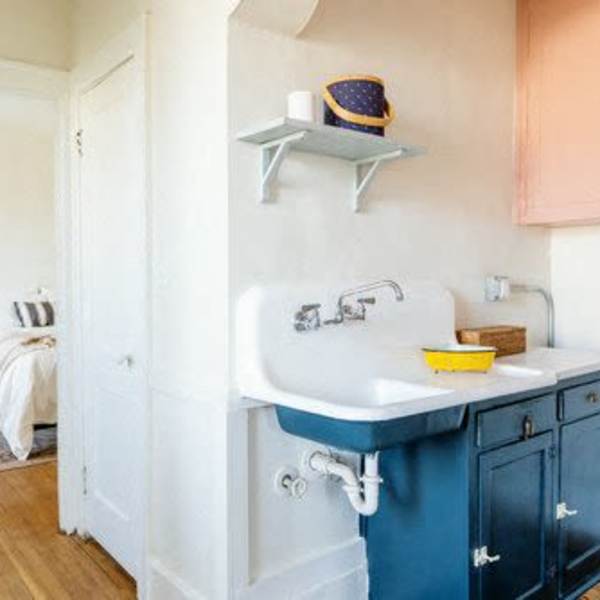 Kitchen blue cabinets and white walls at Detroit Living in Detroit,Michigan