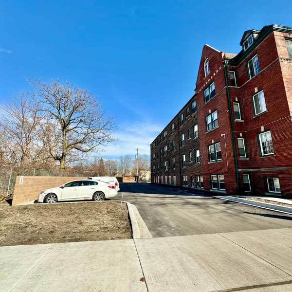 Exterior building with parking lots at Detroit Living in Detroit, Michigan