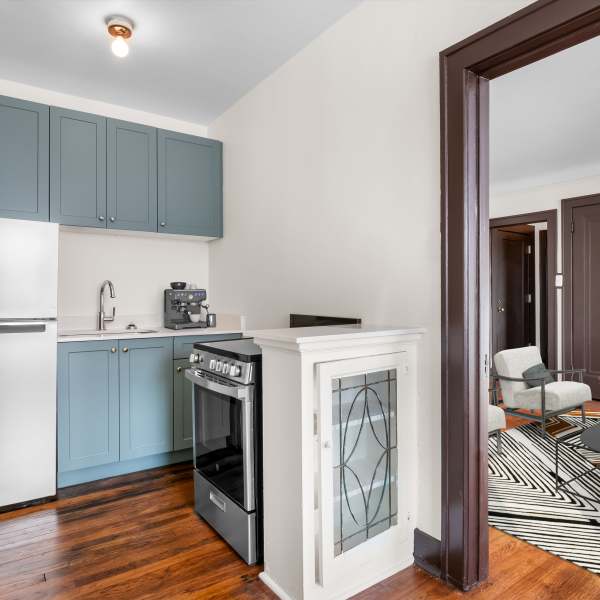 Kitchen with oven at Detroit Living in Detroit, Michigan