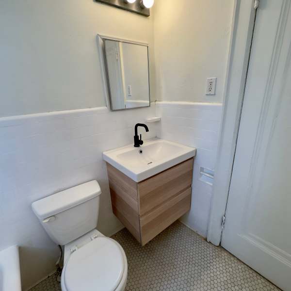Bathroom with soaking bathtub at Detroit Living in Detroit, Michigan