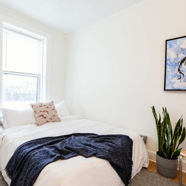 Cozy bedroom at Detroit Living in Detroit, Michigan