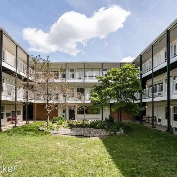 Exterior building with grass at Detroit Living in Detroit, Michigan
