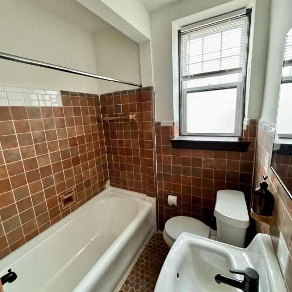 Bathroom with window at Detroit Living in Detroit, Michigan