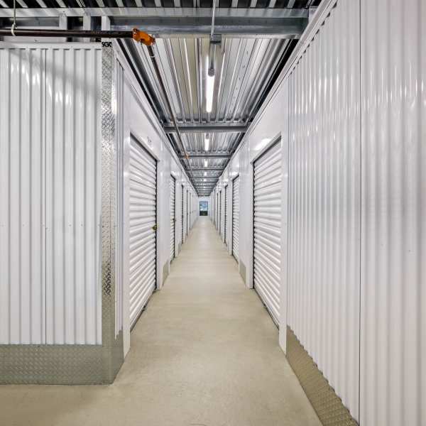 Indoor storage units with bright doors at StorQuest Self Storage in Encinitas, California
