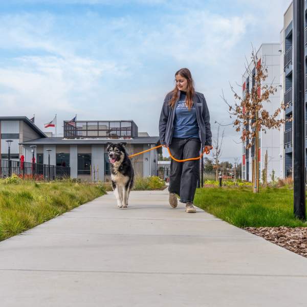 man cuddling his dog at American Property Management in Bellevue, Washington