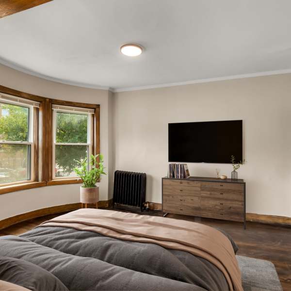Bedroom with TV at Detroit Living in Detroit, Michigan