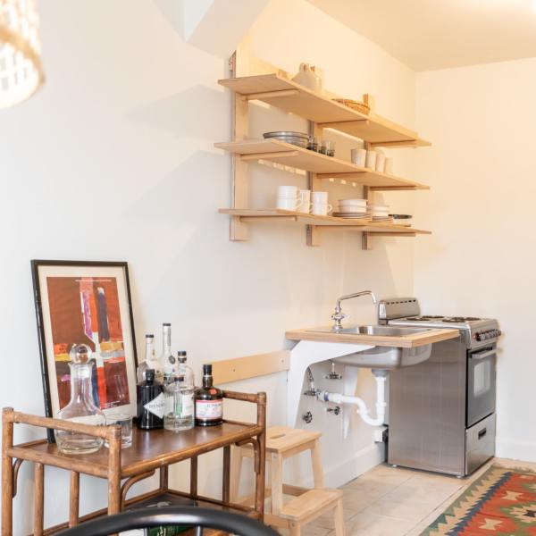 Kitchen with oven at Detroit Living in Detroit, Michigan