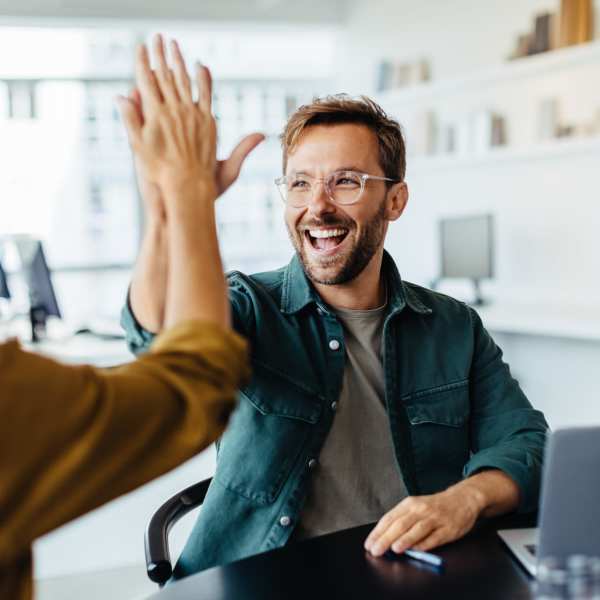 Team members high fiving at Darby Development in Mount Pleasant, South Carolina