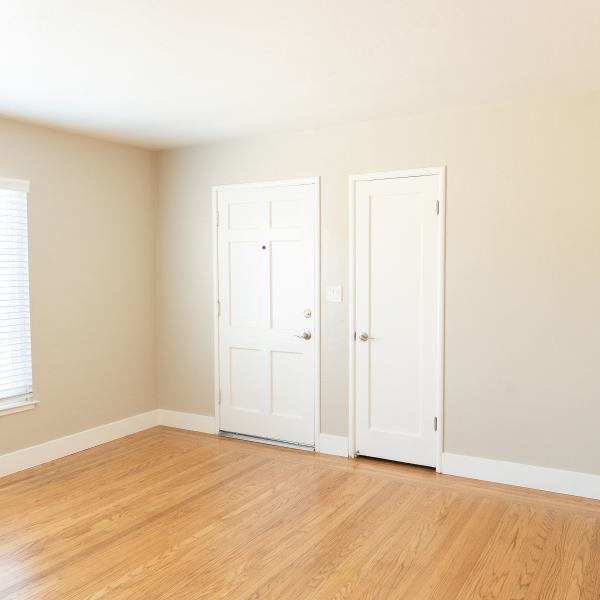 Bedroom with wood-style floors at Garden Place in Hayward, California