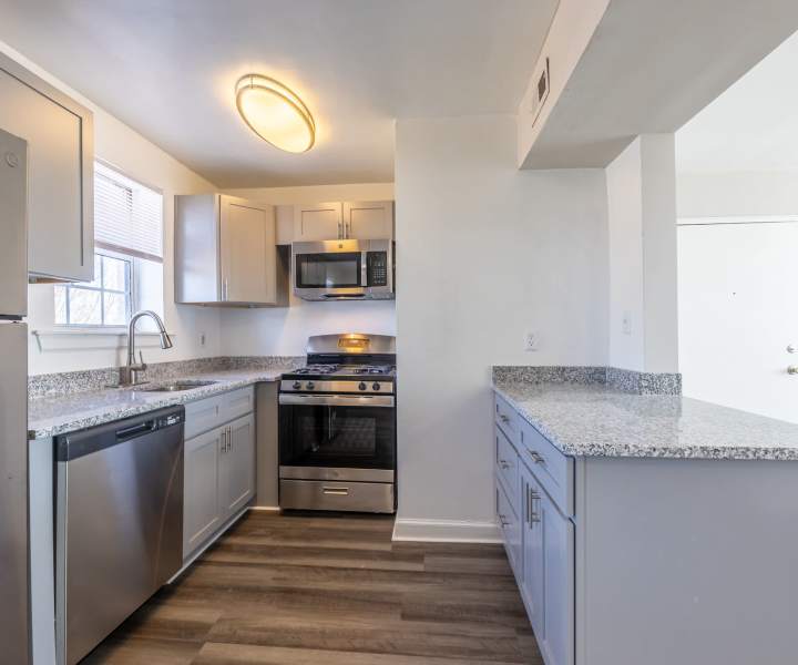 Stainless-steel appliances and wooden cabinets at Parkwood Manor in Norfolk, Virginia