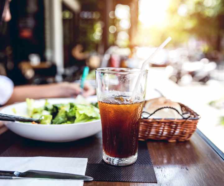 Resident enjoying a cocktail near White Oaks West in Gates, New York