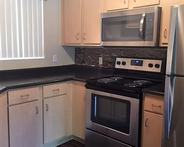 Kitchen features granite countertops at Broadstone Heights in Albuquerque, New Mexico