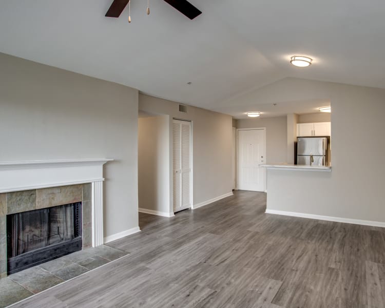 Fireplace and ceiling fan in newly renovated home at Kenwood Club at the Park in Katy, Texas