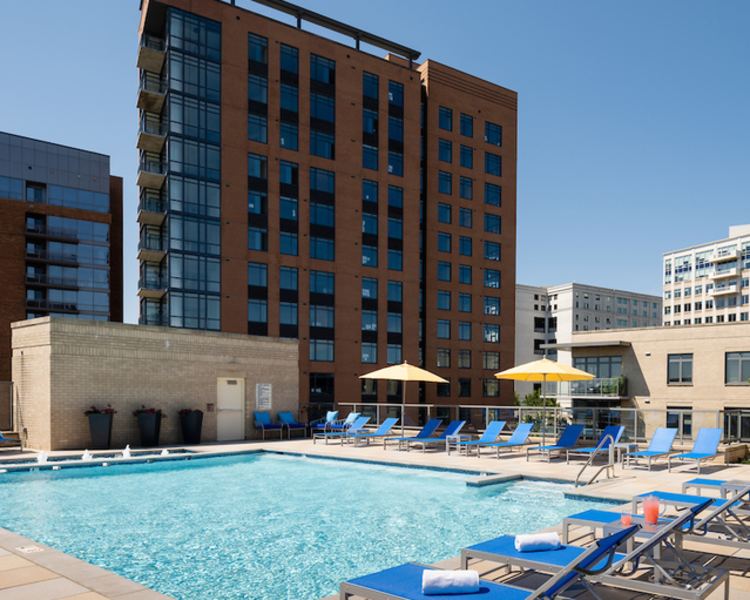 Patio tables with umbrellas at 2001 Clarendon BLVD in Arlington, Virginia