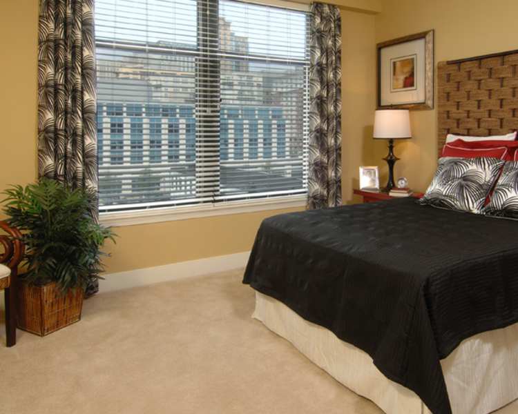Bedroom with large windows at The Eden in Baltimore, Maryland